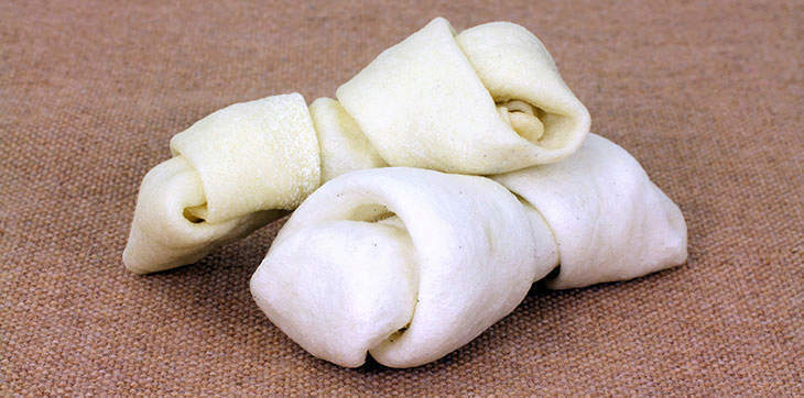 2 knotted rawhide bones